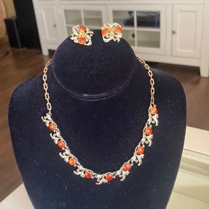 Silvertone with orange accents necklace and clip earring set